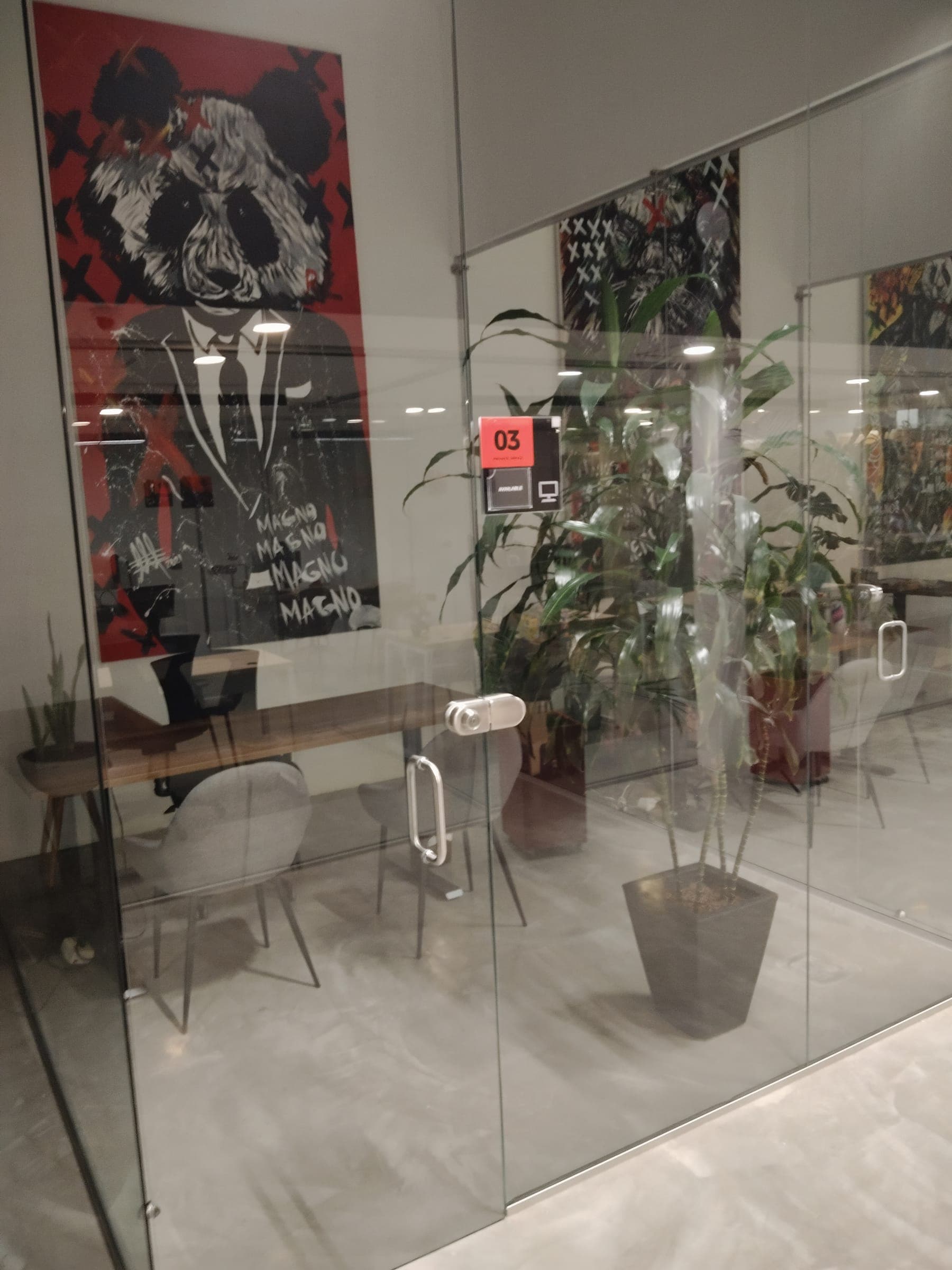 Private office with local artwork and plants