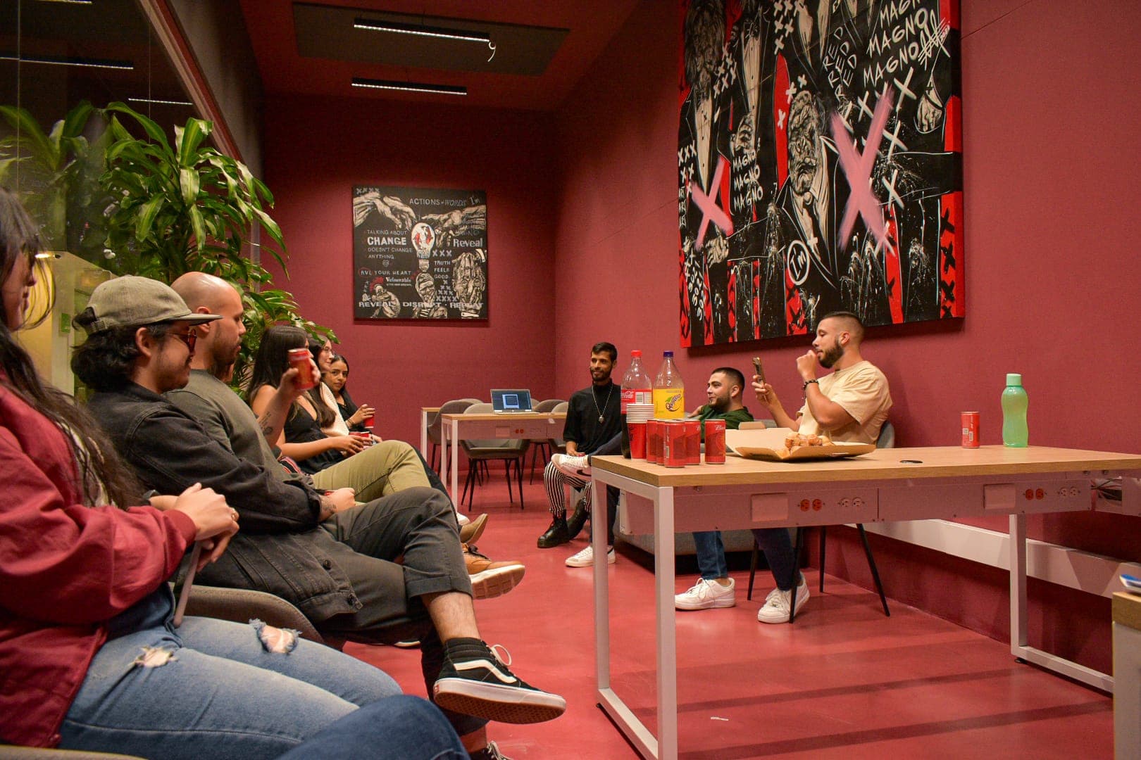 The Red Valley team gathered in the Red Room of the Medellín office